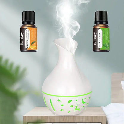 two bottles of essential oil humidifier With Aromatherapy Diffuser